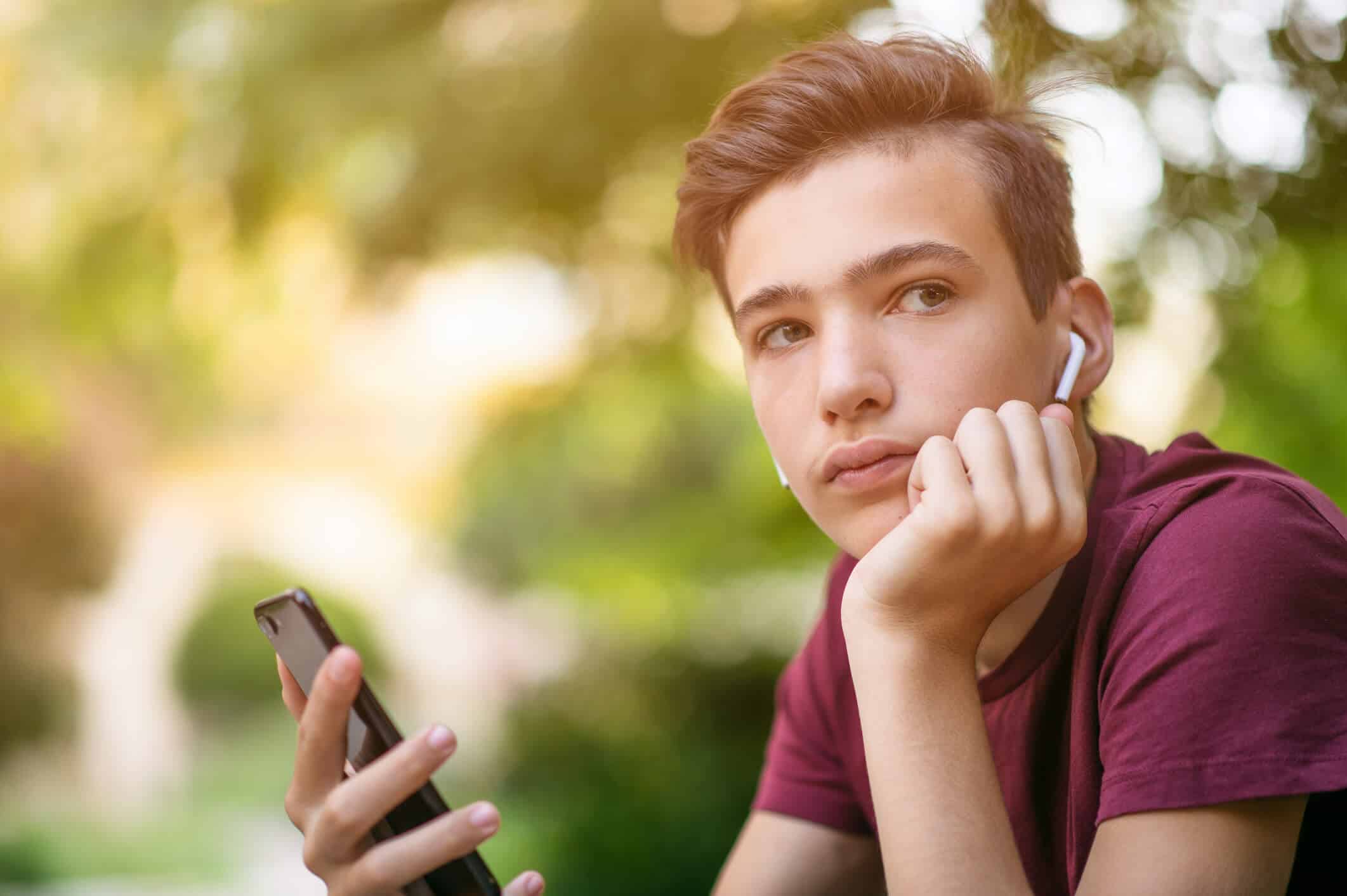 A teenage boy with an iPod.