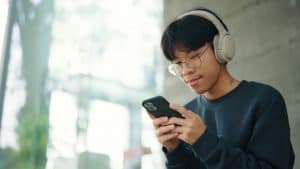Teenager man using smartphone.